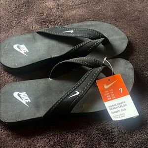 Nike Black Beach Flip Flops size 7.